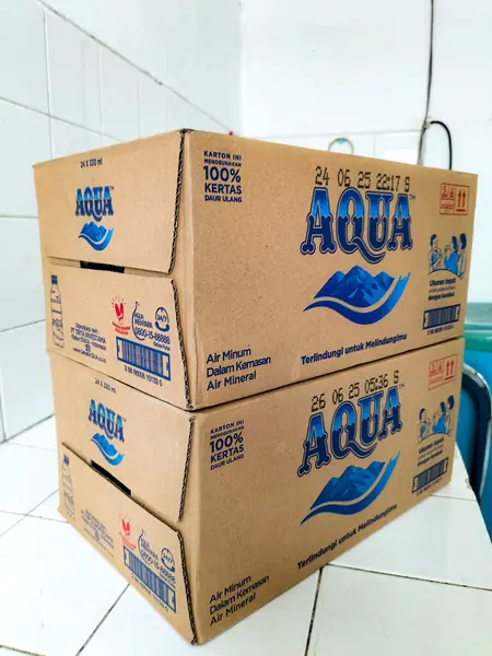 Piles Cartons Filled Drinking Water Branded Aqua Neatly Arranged Corner — Stock Photo, Image