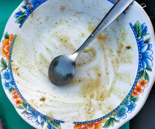 stock image Close-up. The remains of food in plates, crumbs on the table after dinner. Indonesia food.