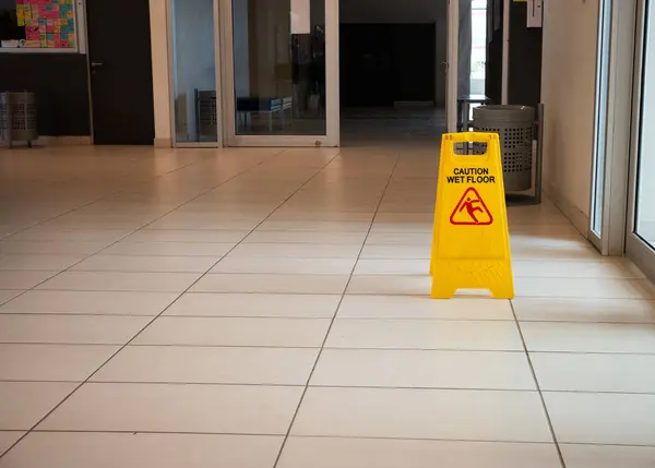 caution wet floor sign on a hall