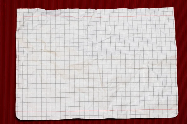 crumpled checkered notebook sheet, background