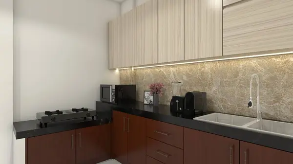 Wooden kitchen cabinet design with black granite countertop and marble backsplash. Kitchen including stove, sink and oven.