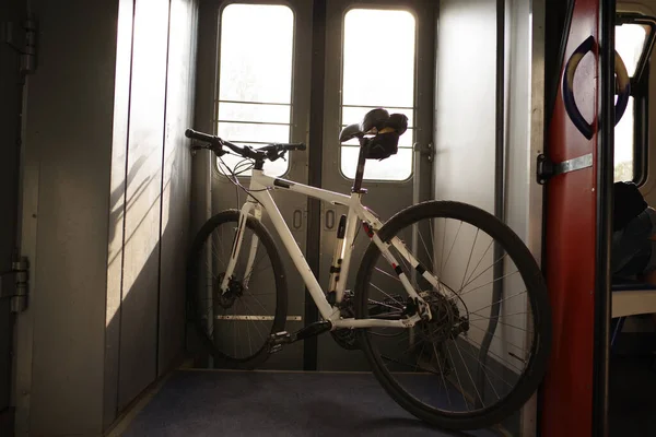 Bicycle standing in the vestibule. Tourism with a bicycle. Transport the bike on the train. Travel with a bike. Sport bike.