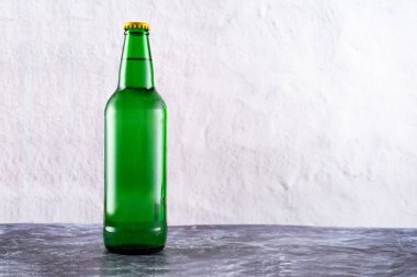 Green glass bottle for drinks. Bottle for lemonade and beer. Front view.