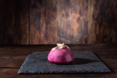 Pink sweet pudding. Pink cake on the table. Front view.