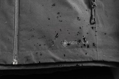 Kyiv, Ukraine, - July 8, 2023 Gore-tex technology and water drops. Water drops on fabric. Breathable fabric. Background and texture of fabric. clipart