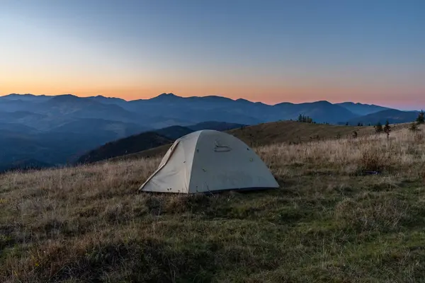 stock image Tourist tent in the mountains. Sunrise in the mountains. Tourist camp and sunrise.