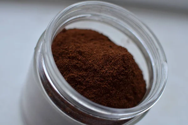 Background of a can of ground coffee on the windowsill