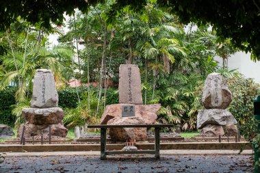 Singapore - July 9 2023: Three Japanese Tombstones Aligned In A Row