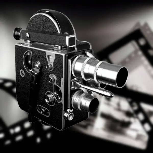 A Vintage Video Camera on the background of old films