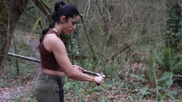 Young Explorer Girl Sharpening Stick Forest Creating Spear Survival Knife — Stock Video