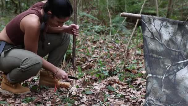 Adventurous Young Girl Gathering Tinder Fire Using Survival Knife Stick — Stock Video