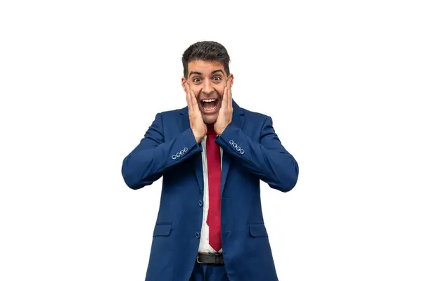 stock image businessman as he holds his hands to his face, expressing joy and surprise. Dressed in a stylish blue suit and tie, his facial expression radiates happiness and excitement white background