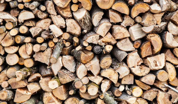 stock image Background from a stack of firewood for a fireplace. Renewable energy source.