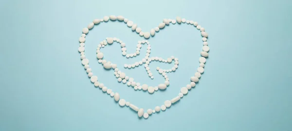 Silhouette Embryo Child People Heart White Tablets Blue Background Treatment — Φωτογραφία Αρχείου