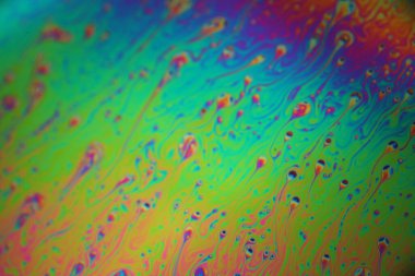 Renkli gökkuşağı sabun köpüğü, psikedelik arka plan. Soyut sıvı renkler ve doku.