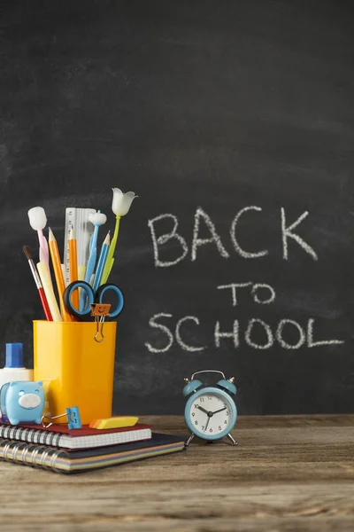 stock image School supplies on wooden desk, back to education.