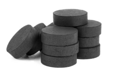 Medical activated charcoal isolated on white background. Help with poisoning and toxins.