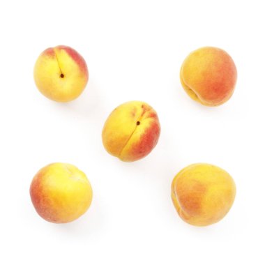 Fresh and juicy apricots on a white background, top view.