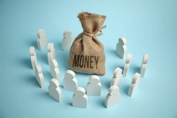 stock image Figures of people are drawn to bag of money and wealth.