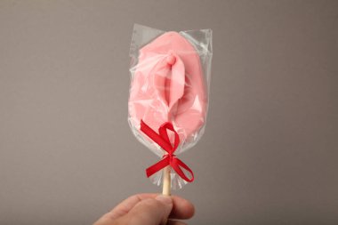 Sweet candy in form of female vagina. Orgasm, prelude and pleasure.