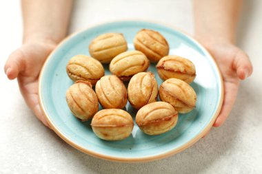 National sweets of russia - nuts with condensed milk. Homemade New Year's baked goods. Isolated on white.