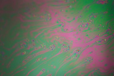 Renkli gökkuşağı sabun köpüğü, psikedelik arka plan. Soyut sıvı renkler ve doku.