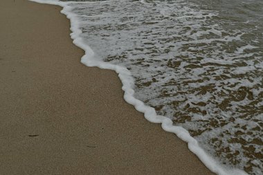 Kumda deniz dalgalarının arkaplanı