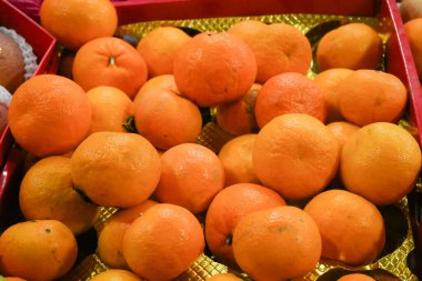 Fresh orange fruit in basket clipart