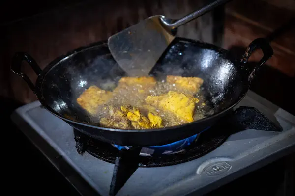 stock image Indonesian food. Tempeh being fried