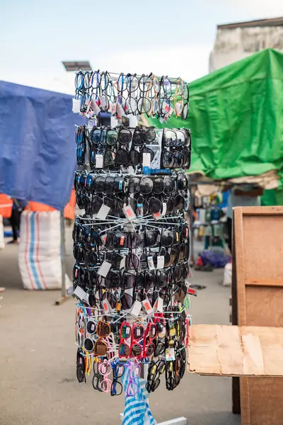 stock image Ambon, Indonesia - June 29, 2024: Selling glasses at a traditional market. Mardika Market, Ambon