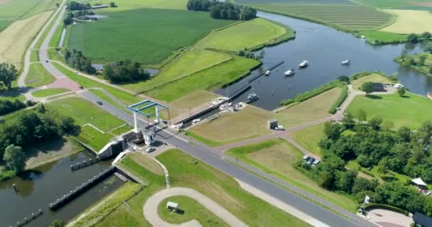 Row Recreational Boats Leaving Sluice Friesland Alankomaat Drone Footage — kuvapankkivideo