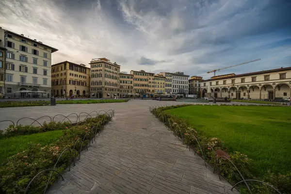 A wide angle photo of an unusually empty Plaza Santa Maria in the morning in Florence, Italy