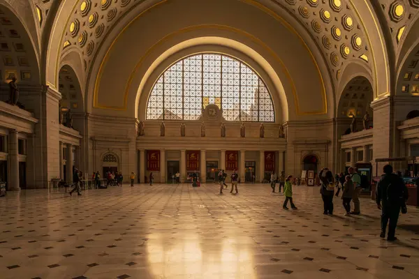 stock image Union Station Washington DC USA  March 16 2019. A wide angle morning photo taken in Union Station with sunlight streaming in from a large window to light the interior of the station. 