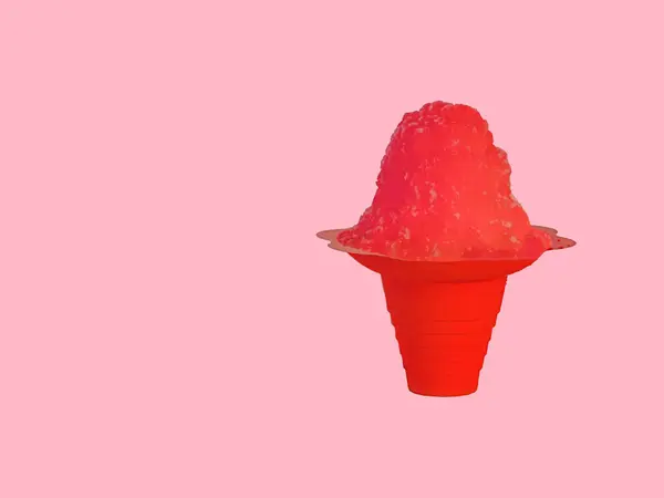 Vivid Red Hawaiian Shave Ice, Shaved Ice or a Snow Cone on a light pink background with copy space.