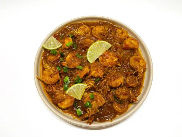 stock image Udang bumbu balado. Shrimp with spicy chili sauce isolated on white. Traditional cuisine from West Sumatra, Indonesia. Perfect for recipe, article, catalogue, or any cooking contents.