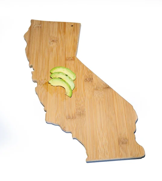 Abacate Uma Placa Corte Forma Califórnia — Fotografia de Stock