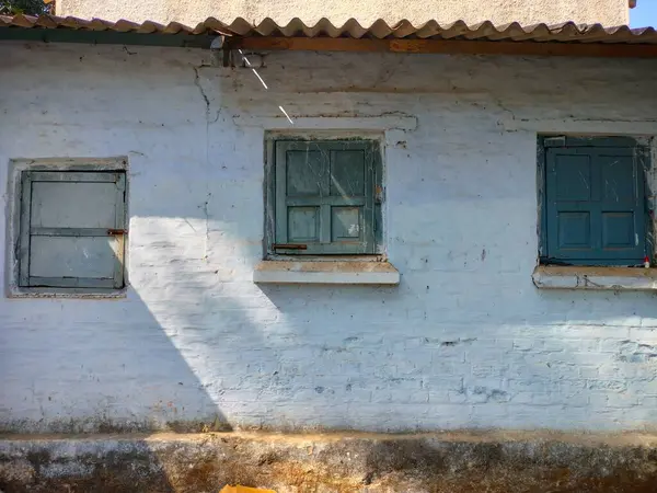 Old aged window at rural home wall. old window