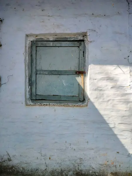 Old aged window at rural home wall. old window