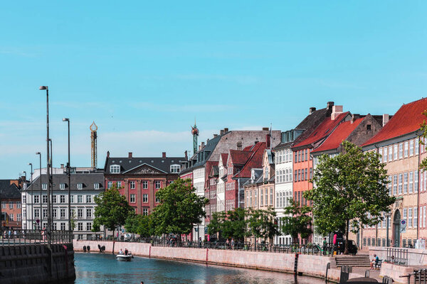 Beautiful historical center of Copenhagen with ancient buildings and a water canal with boats. Copenhagen, Denmark - Novemner 17, 2023