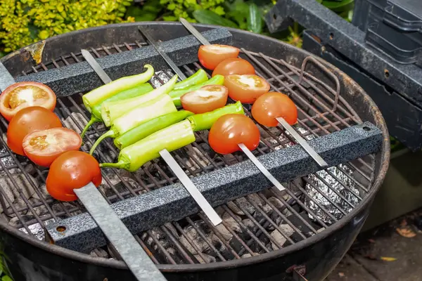 Food for vegans. Grilled tomatoes and peppers. High quality photo