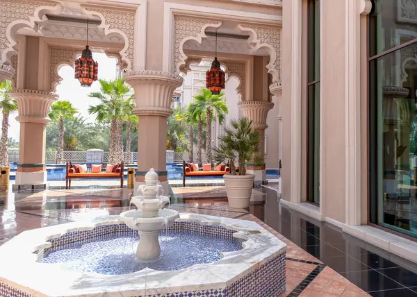 Recreation area with a fountain in an expensive hotel in Dubai. Hotel interior in middle east style. High quality photo
