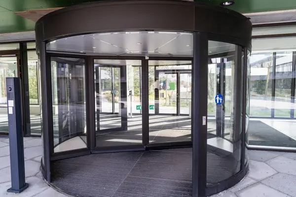 Modern entrance with revolving door. Entrance to a building and glass door.