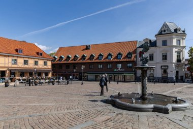 Street, Central square in the ancient city on as sunny summer day. Ystad, Sweden - May 14, 2024 clipart
