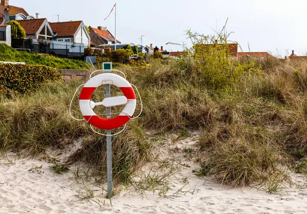 stock image Lifebuoy at the beach in Denmark on a sunny summer. Bornholm, Denmark