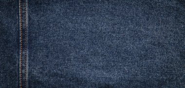  texture of blue jeans denim fabric with seam background