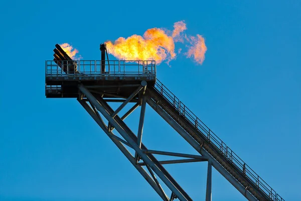 Offshore oil rig flare stack with gas flame