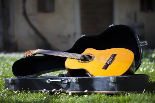 Acoustical guitar Ready to be Played on a Sunny Nice Day - Music Performance in Spring Summer Concept
