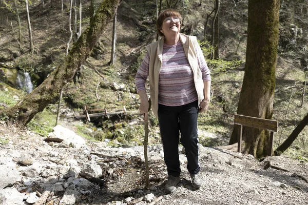 Senior Woman Active Lifestyle with Sunday Walking in Fresh air of a Forest