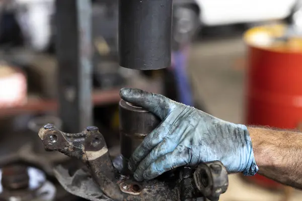 Danger of Using a Hydraulic Press During Replacing of a Car Wheel Bearing in a Garage