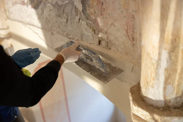 Restorer Restore Work on Gothic Church Columns and Walls. Expert Renovation Preserving European Christianity Heritage